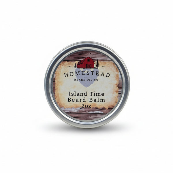 Homestead Beard Oil Co. Island Time Beard Balm container on grass with a scenic background