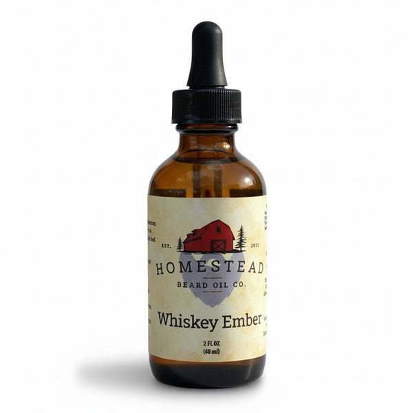 Bottle of Homestead Brand Oil Co. Whiskey Ember oil with a scenic background