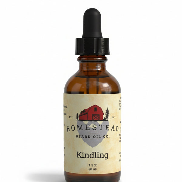 Bottle of Homestead Kindling oil with a field and blue sky in the background