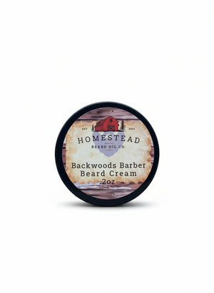 Homestead Barber Co. Backwoods Barber Beard Cream container on a hay bale with a scenic background