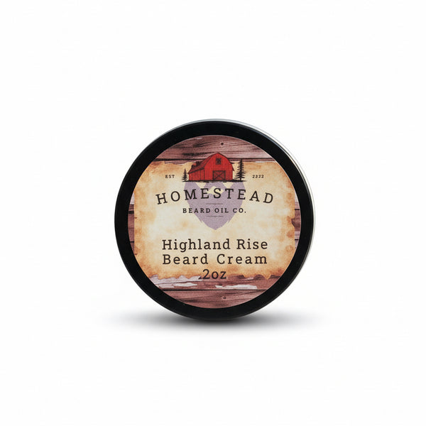 Homestead Brand Co. Highland Rise Beard Cream container on a hay bale with a blurred natural background