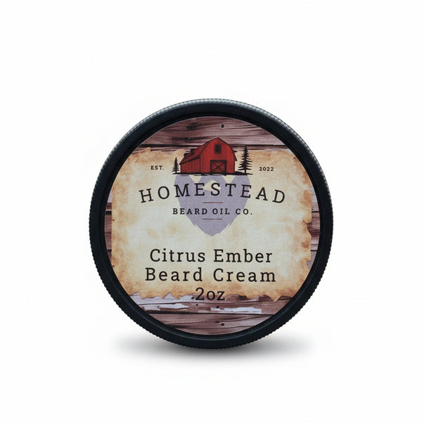 Homestead Beard Oil Co. Citrus Ember Beard Cream container on grass with a blurred natural background