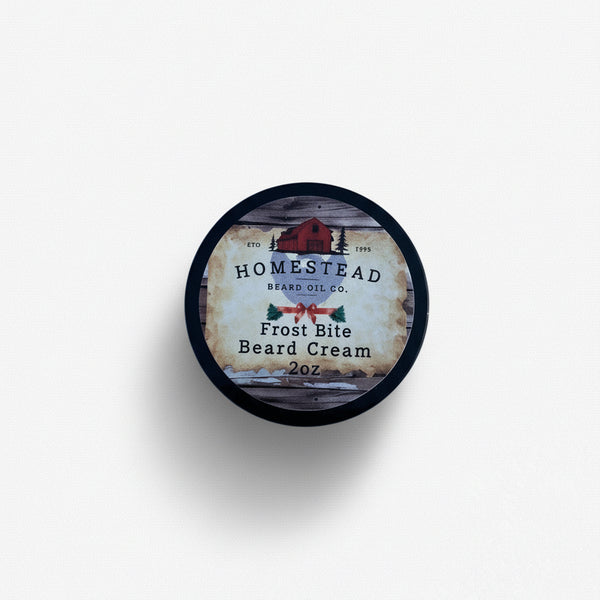 Homestead beard cream jar surrounded by peppermint candies, on snow